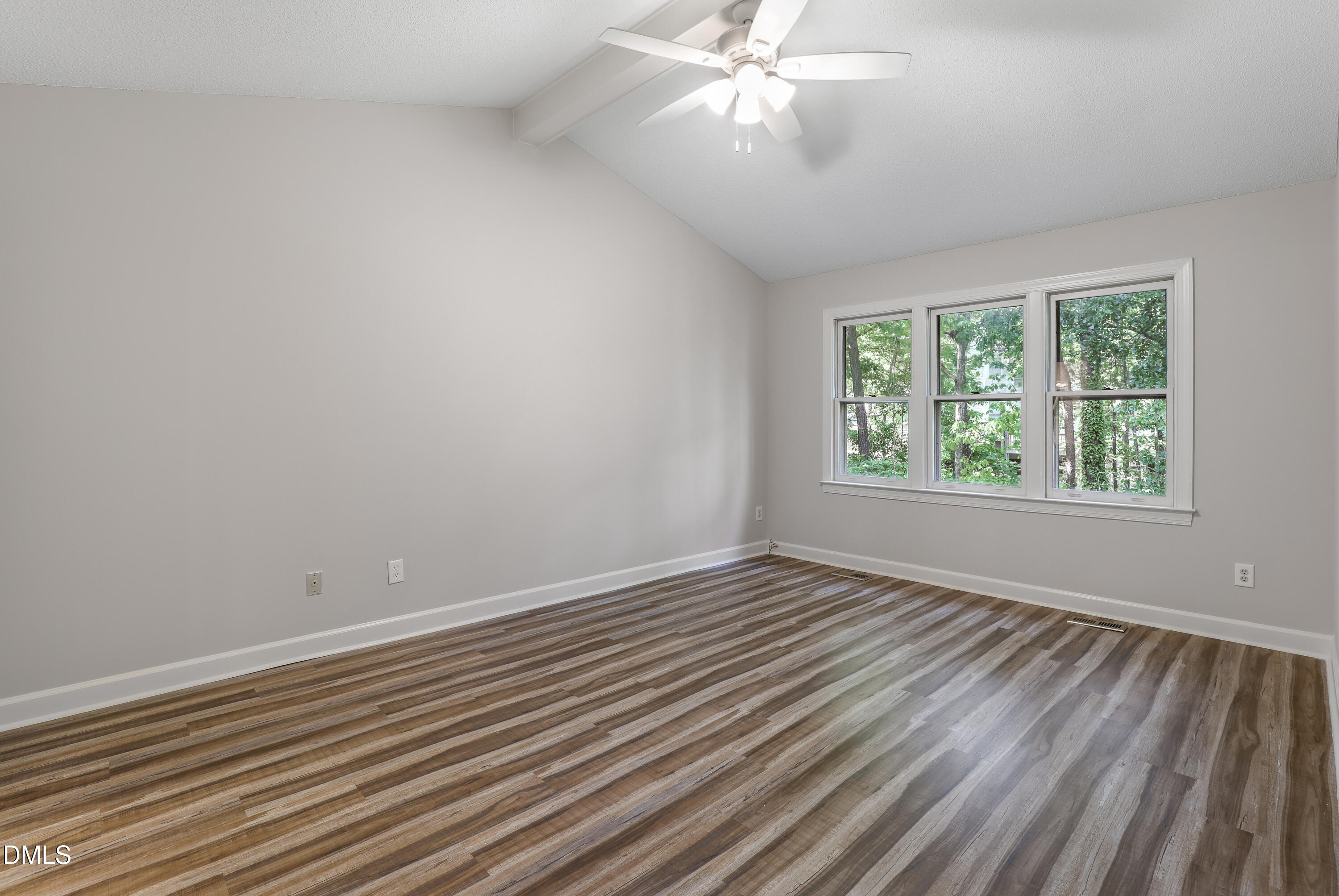 15 Preakness Drive Durham, NC 27713 - Photo 14 of 32 an empty room with wooden floor chandelier fan and windows