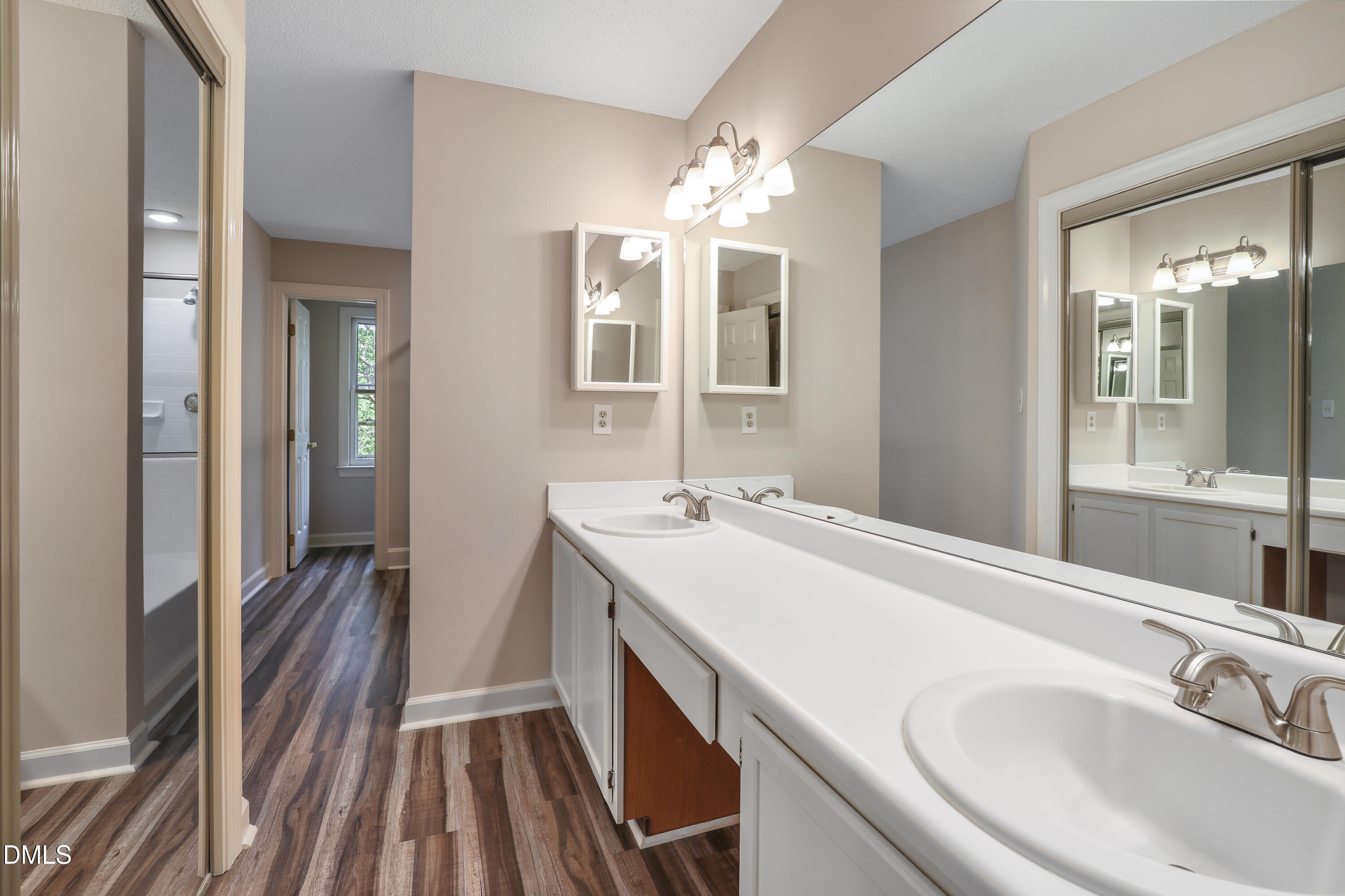 15 Preakness Drive Durham, NC 27713 - Photo 15 of 32 a bathroom with a sink and a mirror