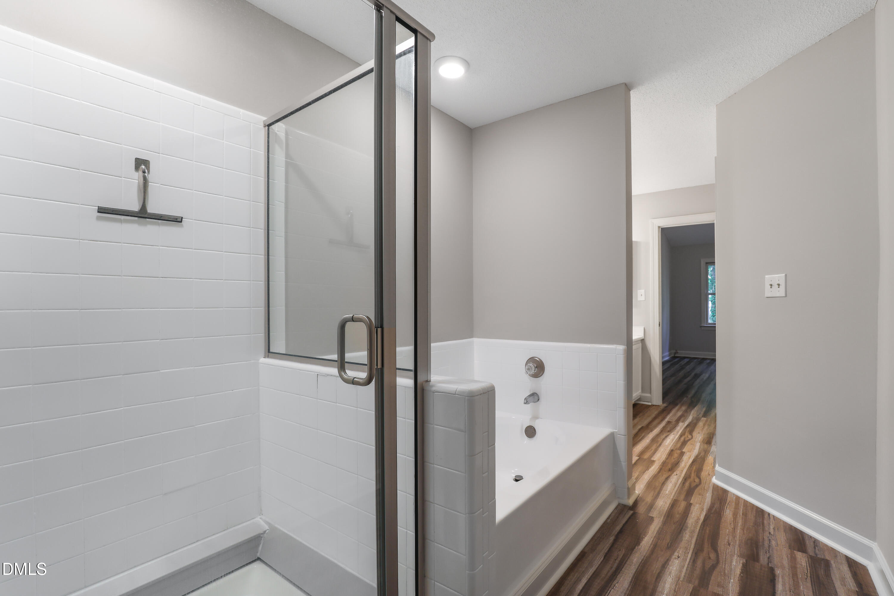 15 Preakness Drive Durham, NC 27713 - Photo 16 of 32 a bathroom with a bathtub and a shower