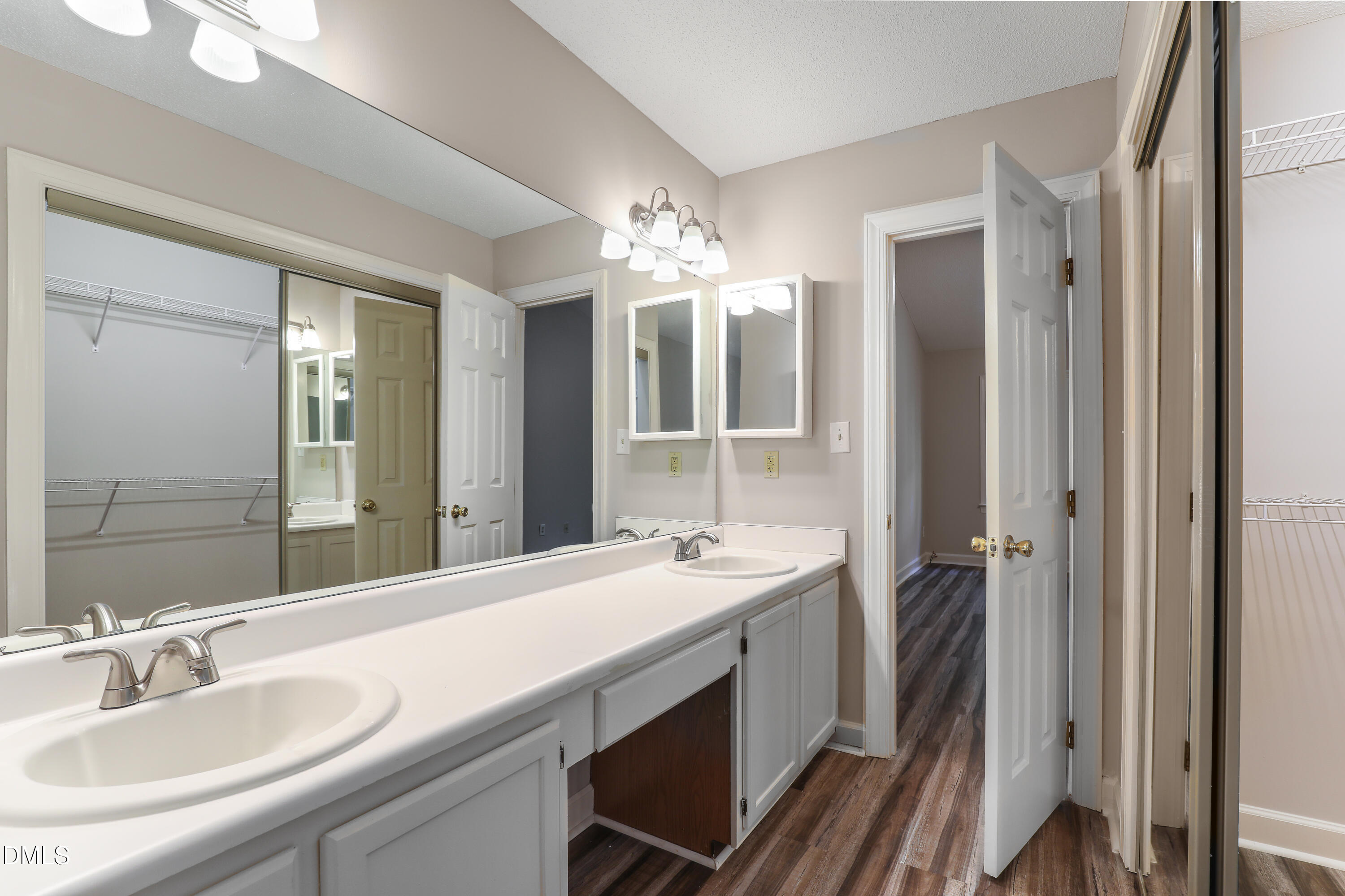 15 Preakness Drive Durham, NC 27713 - Photo 17 of 32 a en suite bathroom with a double vanity sink and a mirror