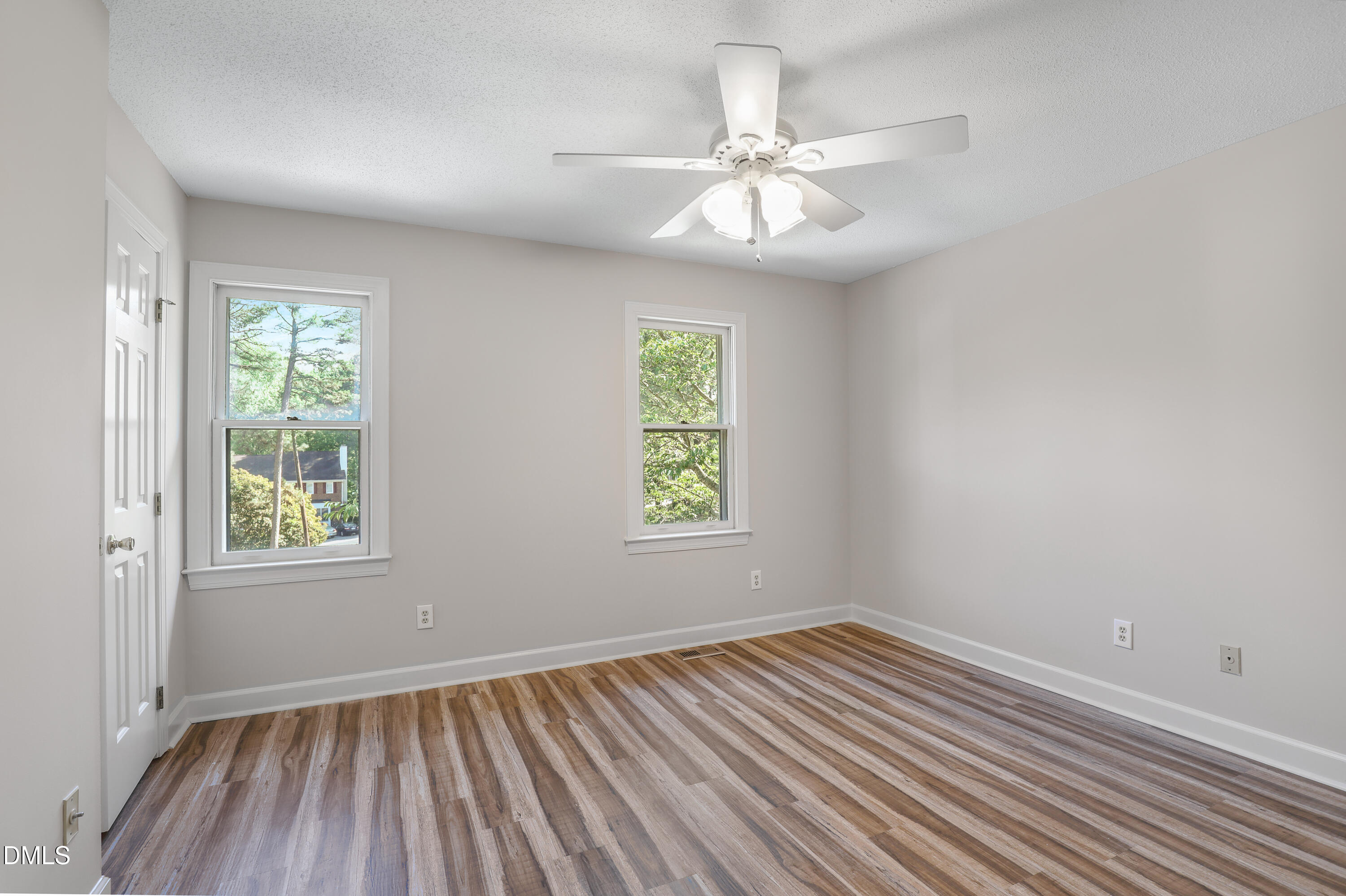 15 Preakness Drive Durham, NC 27713 - Photo 18 of 32 a view of an empty room with wooden floor and a window