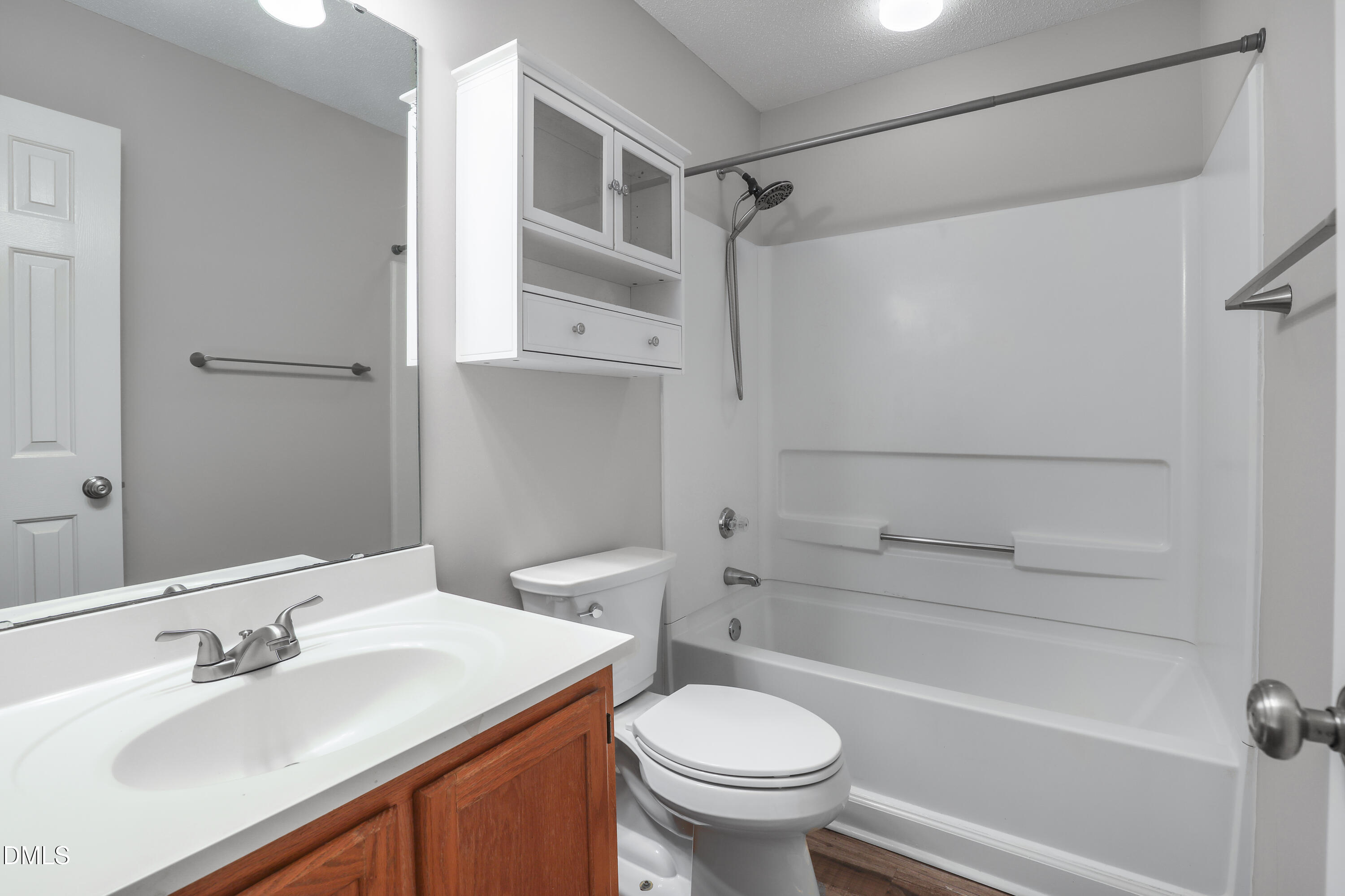 15 Preakness Drive Durham, NC 27713 - Photo 19 of 32 a bathroom with a sink toilet and shower