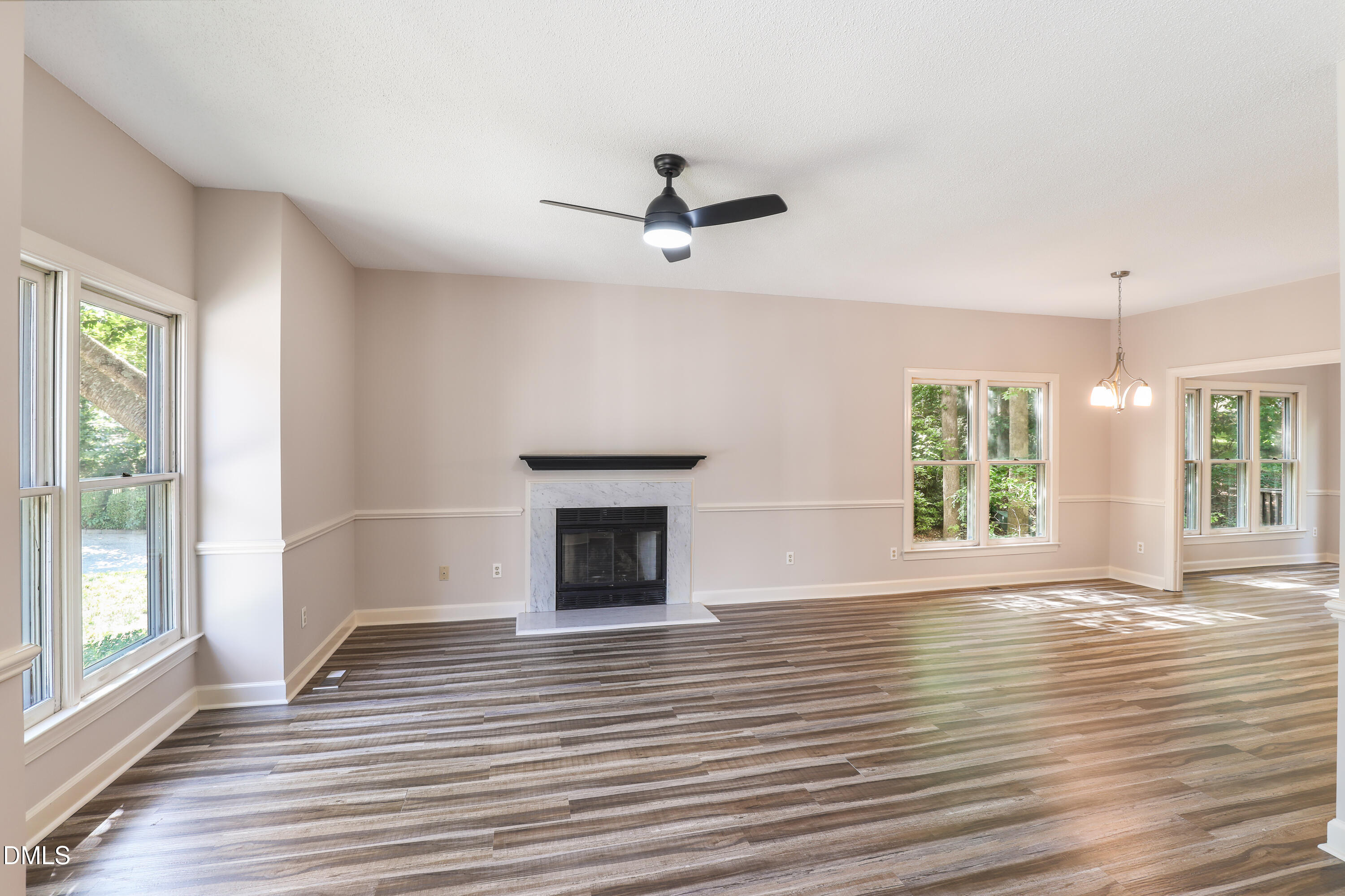 15 Preakness Drive Durham, NC 27713 - Photo 2 of 32 wooden floor in an empty room with a window
