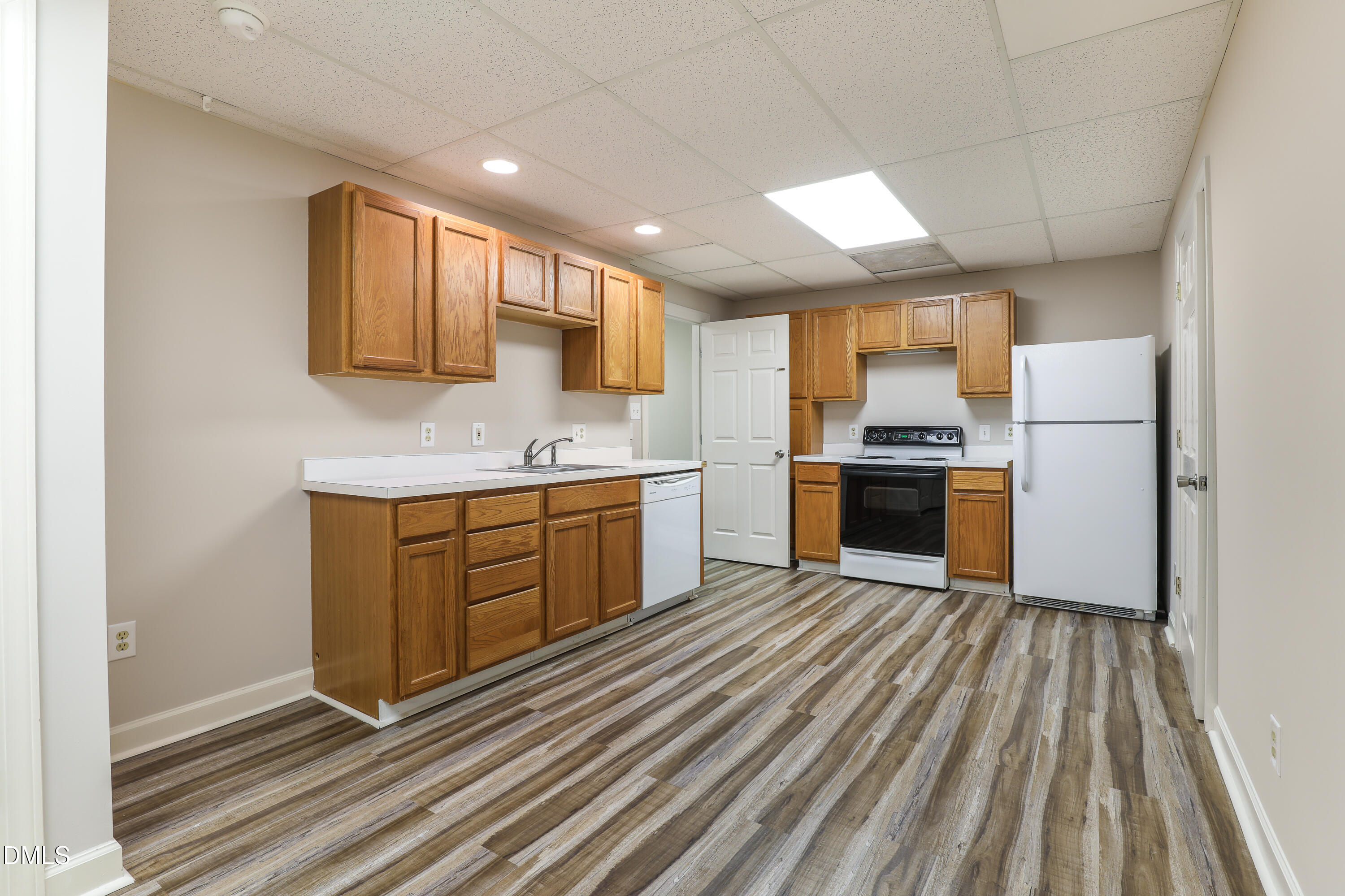 15 Preakness Drive Durham, NC 27713 - Photo 22 of 32 a kitchen with a sink appliances and cabinets