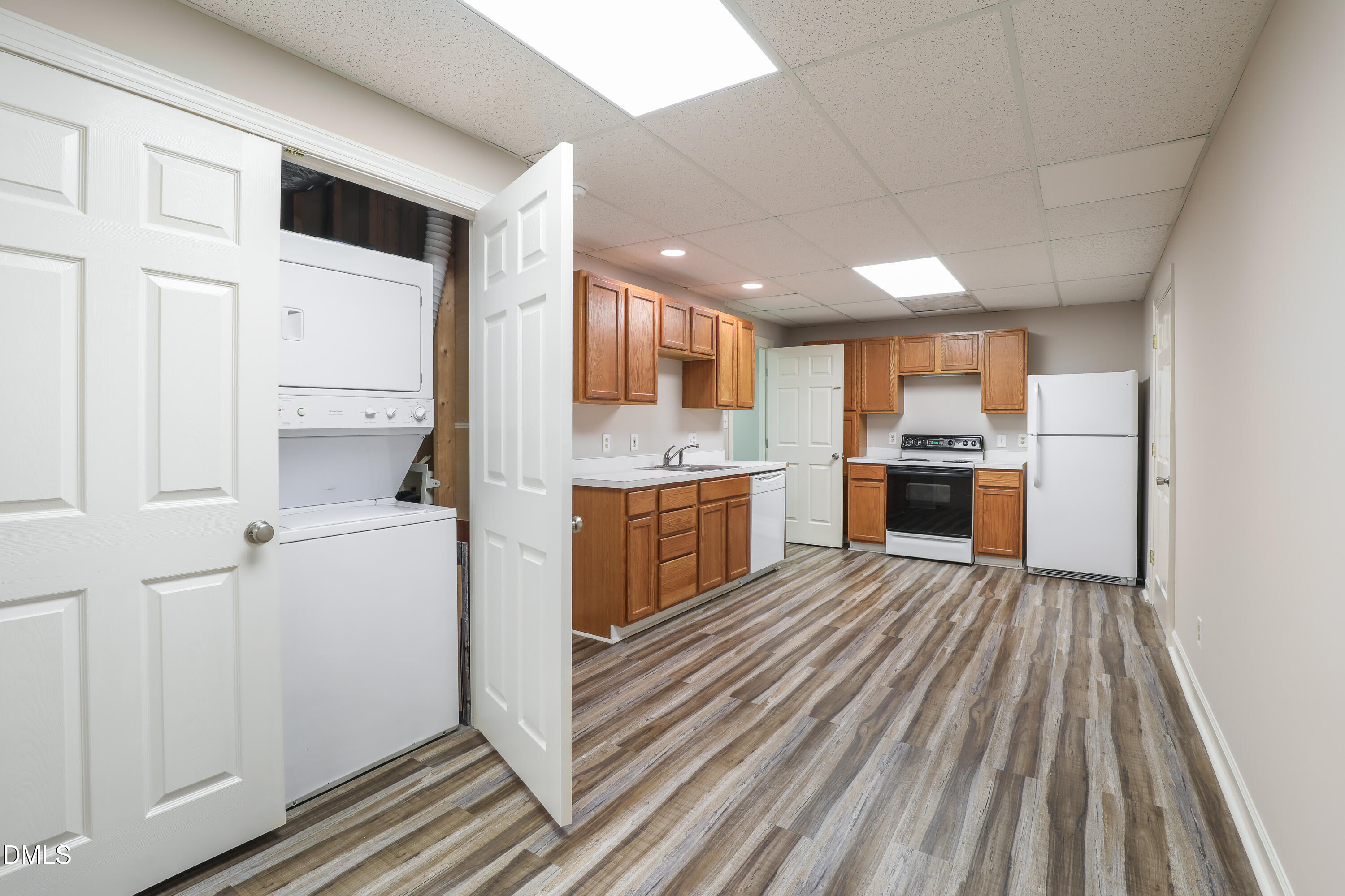 15 Preakness Drive Durham, NC 27713 - Photo 23 of 32 a kitchen with wooden cabinets and stainless steel appliances