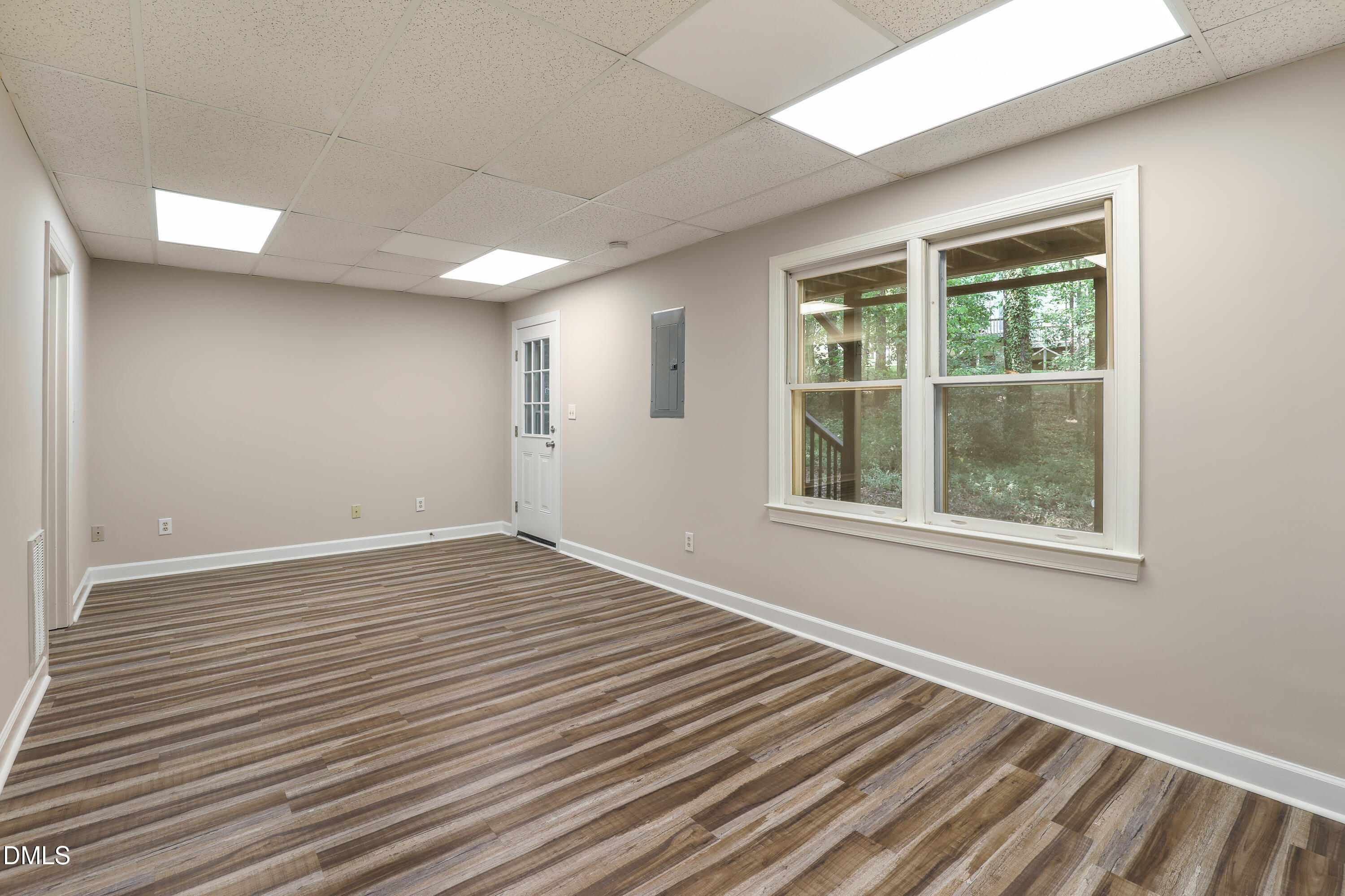 15 Preakness Drive Durham, NC 27713 - Photo 24 of 32 a view of an empty room with wooden floor and a window