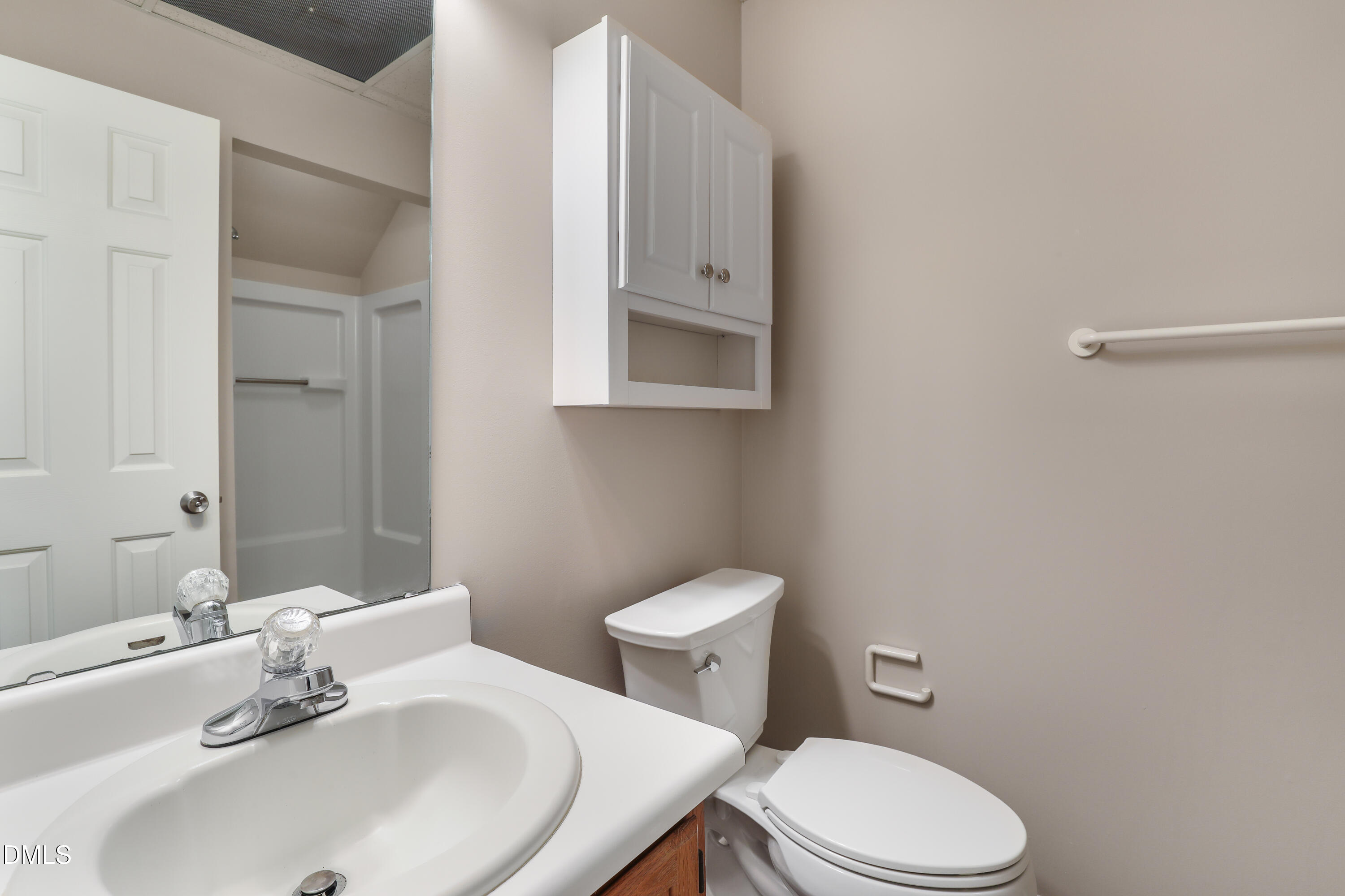 15 Preakness Drive Durham, NC 27713 - Photo 28 of 32 a bathroom with a sink a toilet and mirror
