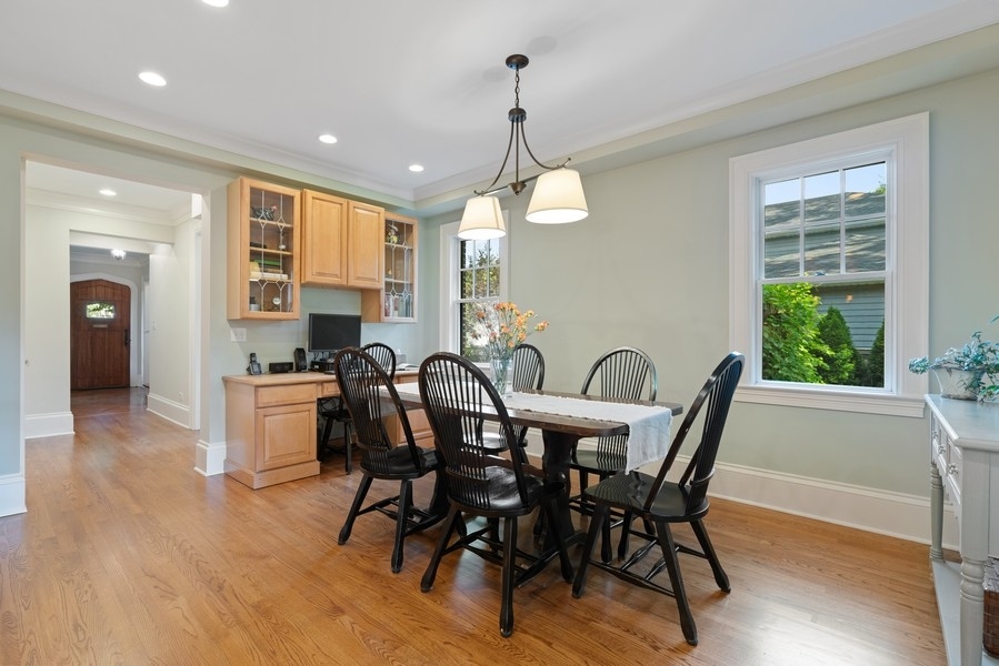 727 Indian Road Glenview, IL 60025 - Photo 12 of 58 a view of a a dining room with furniture window and wooden floor