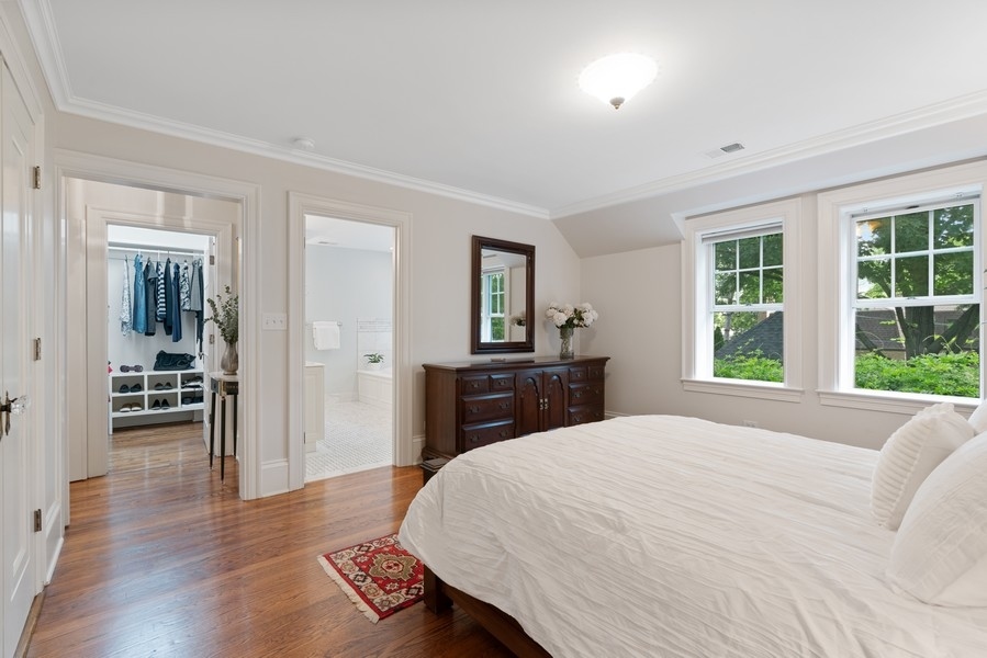 727 Indian Road Glenview, IL 60025 - Photo 17 of 58 a bedroom with a bed and wooden floor