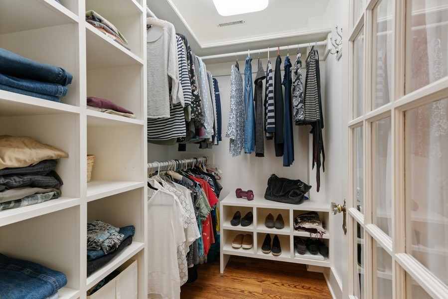 727 Indian Road Glenview, IL 60025 - Photo 22 of 58 a view of walk in closet with clothes and shoes
