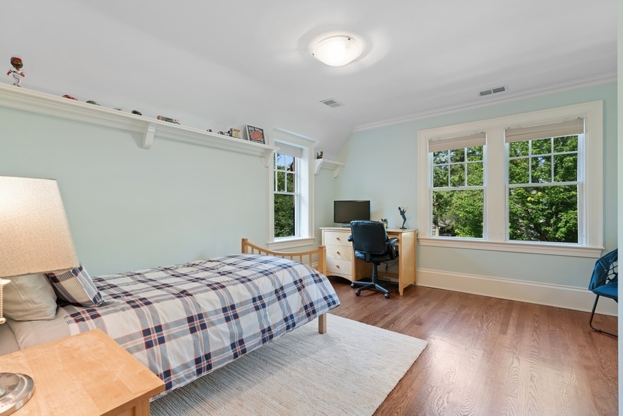 727 Indian Road Glenview, IL 60025 - Photo 23 of 58 a bedroom with a bed and a large window