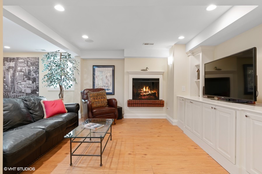 727 Indian Road Glenview, IL 60025 - Photo 36 of 58 a living room with furniture and a fireplace
