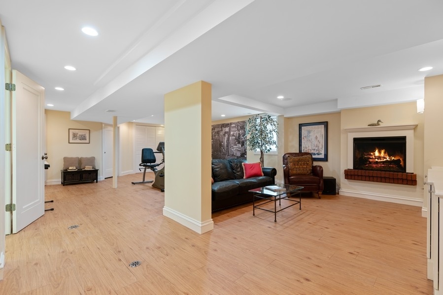 727 Indian Road Glenview, IL 60025 - Photo 38 of 58 a living room with furniture and a fireplace