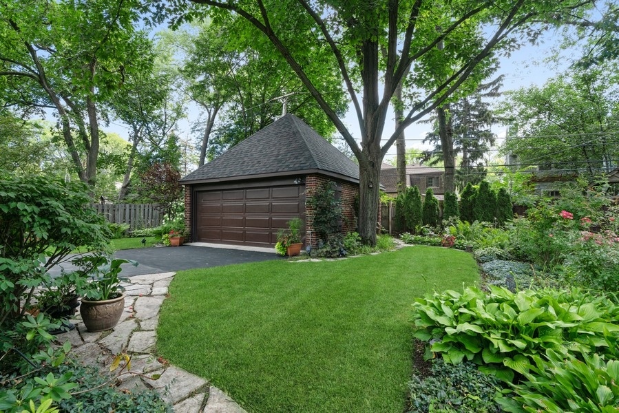 727 Indian Road Glenview, IL 60025 - Photo 46 of 58 a front view of a house with garden