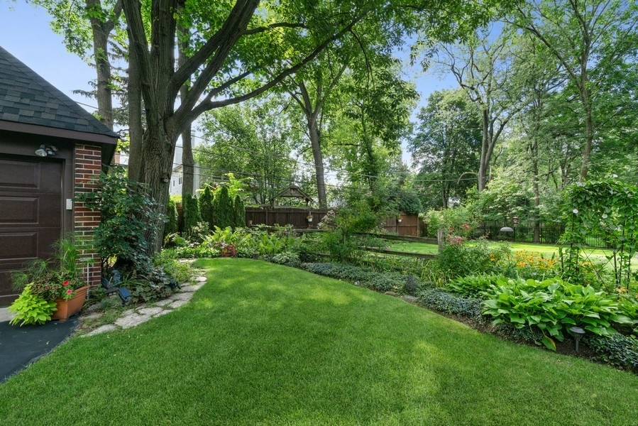 727 Indian Road Glenview, IL 60025 - Photo 49 of 58 a view of a backyard with large trees