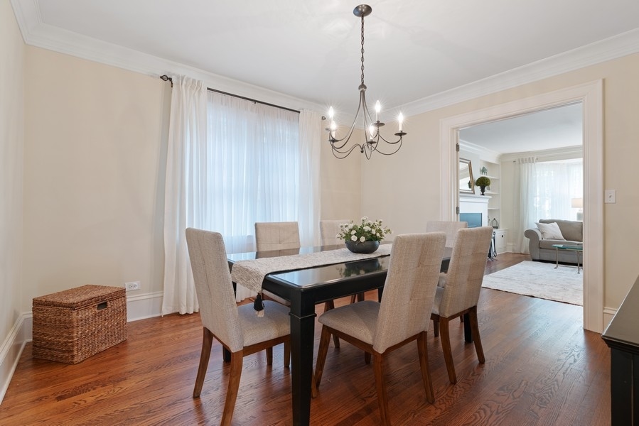 727 Indian Road Glenview, IL 60025 - Photo 6 of 58 a view of a dining room with furniture wooden floor and chandelier