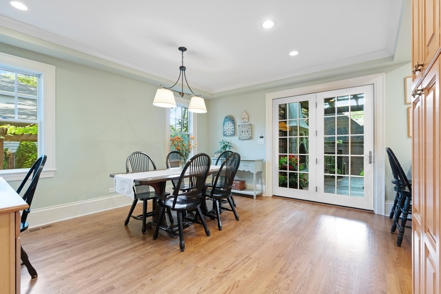 727 Indian Road Glenview, IL 60025 - Photo 10 of 58 a view of a dining room with furniture window and wooden floor
