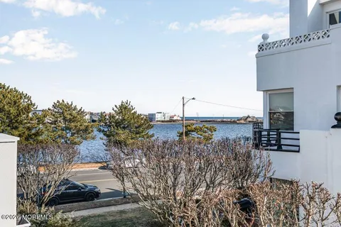 a view of a terrace with a bench and sky view