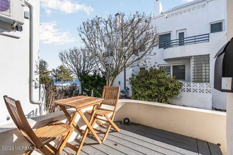 a view of balcony with furniture