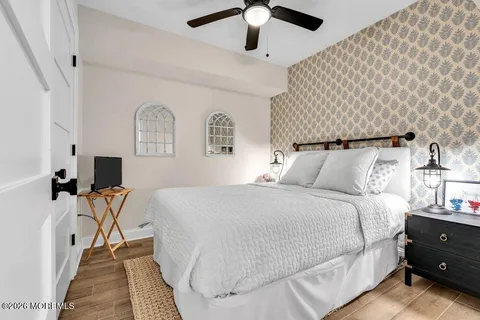 a bedroom with a bed and a chandelier