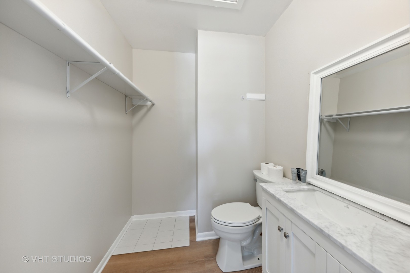 2855 Koepke Road Northbrook, IL 60062 - Photo 13 of 18 a bathroom with a granite countertop toilet and a sink