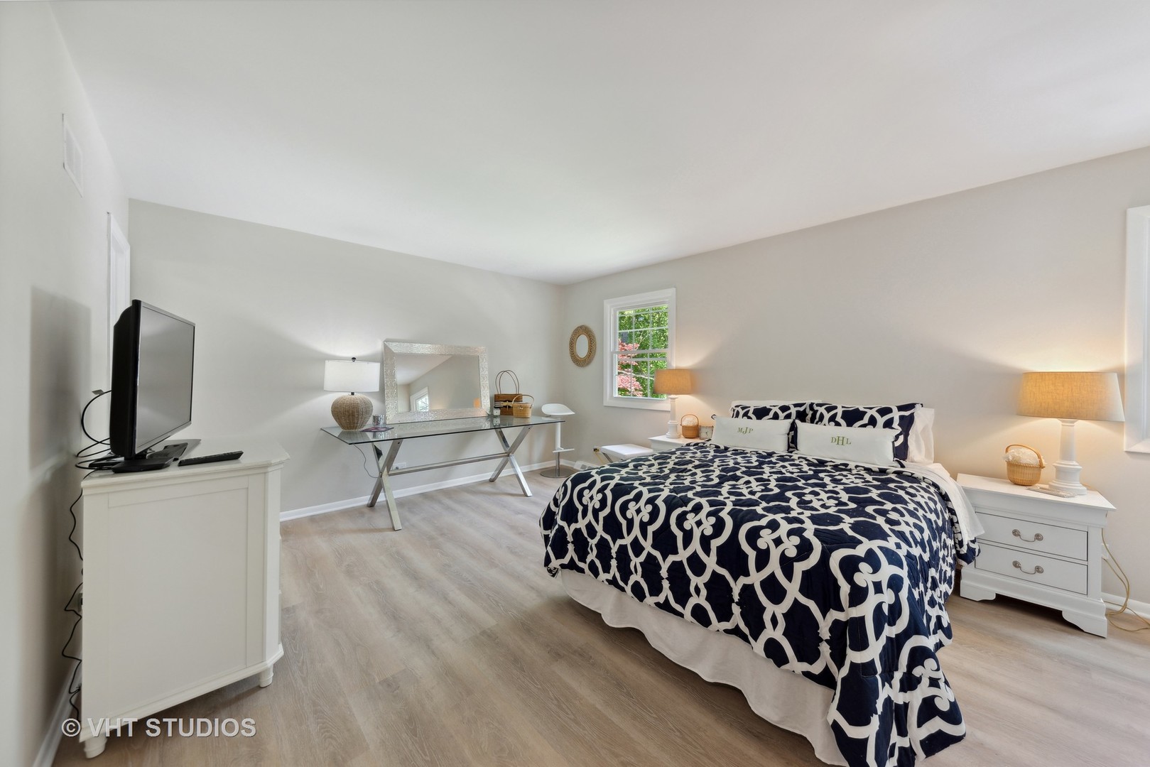 2855 Koepke Road Northbrook, IL 60062 - Photo 10 of 18 a bedroom with a bed flat screen tv and window