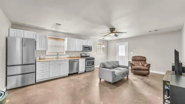 a bedroom with a bed and a table