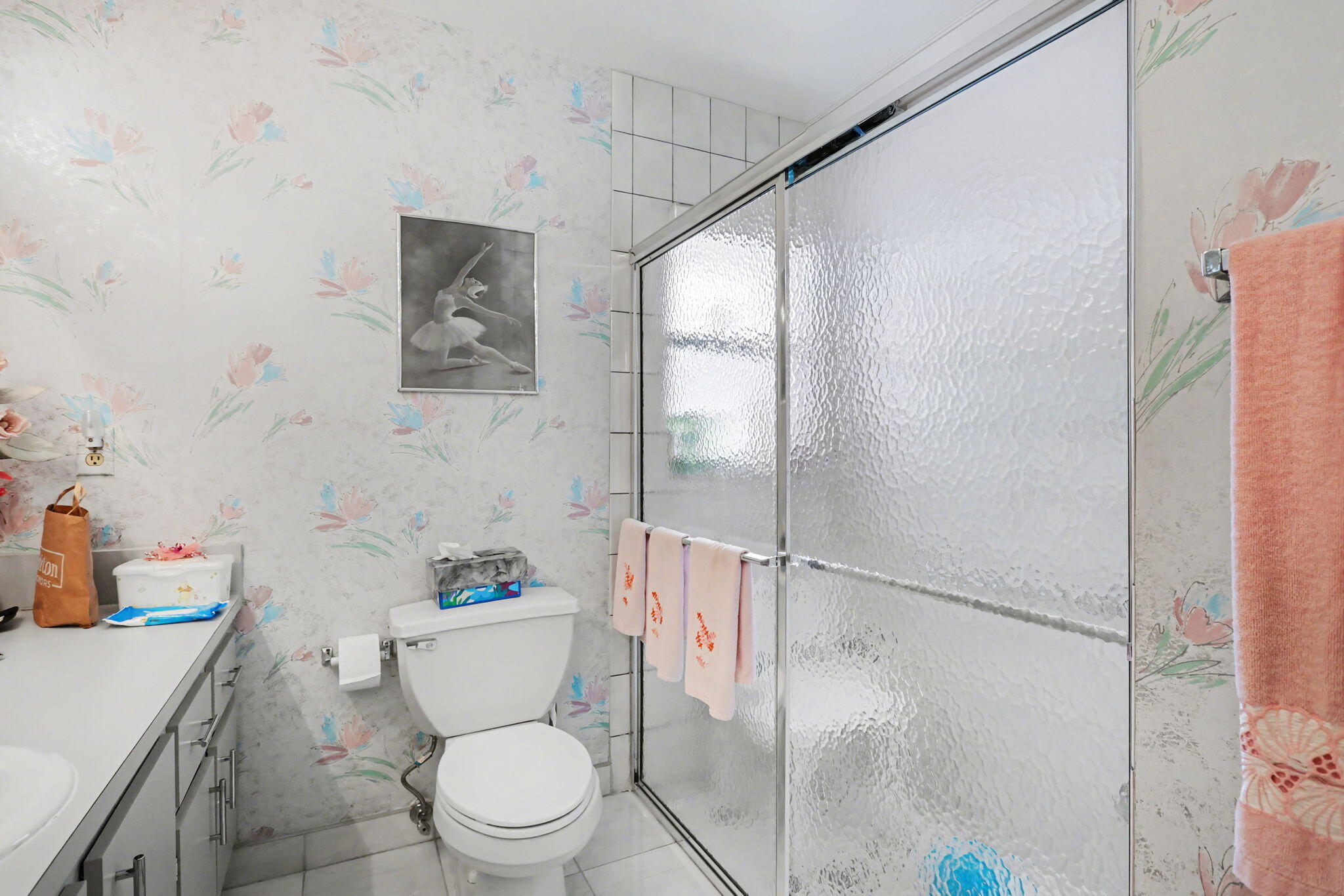 9476 El Clair Ranch Road Boynton Beach, FL 33437 - Photo 22 of 28 a bathroom with a toilet a sink and a shower