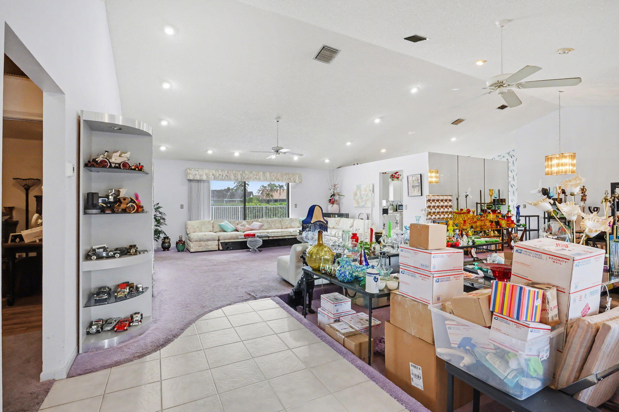 9476 El Clair Ranch Road Boynton Beach, FL 33437 - Photo 8 of 28 a living room filled with furniture and a table