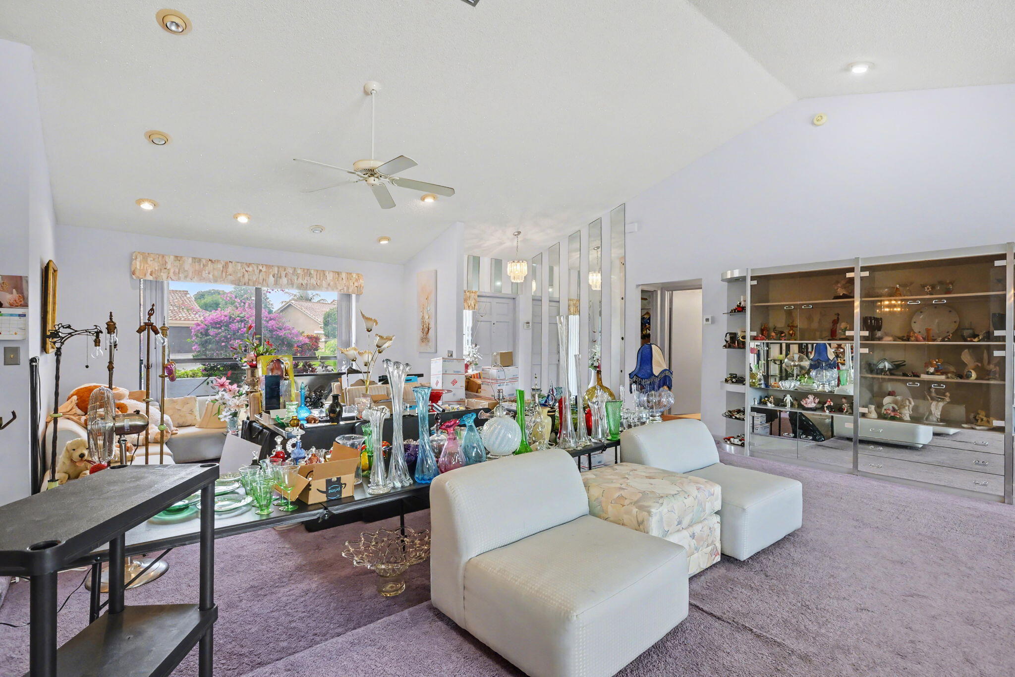 9476 El Clair Ranch Road Boynton Beach, FL 33437 - Photo 10 of 28 a living room with furniture and a chandelier