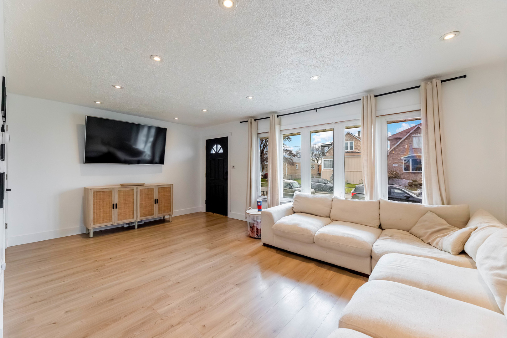 5105 South Mobile Avenue Chicago, IL 60638 - Photo 3 of 21 a living room with furniture and a flat screen tv