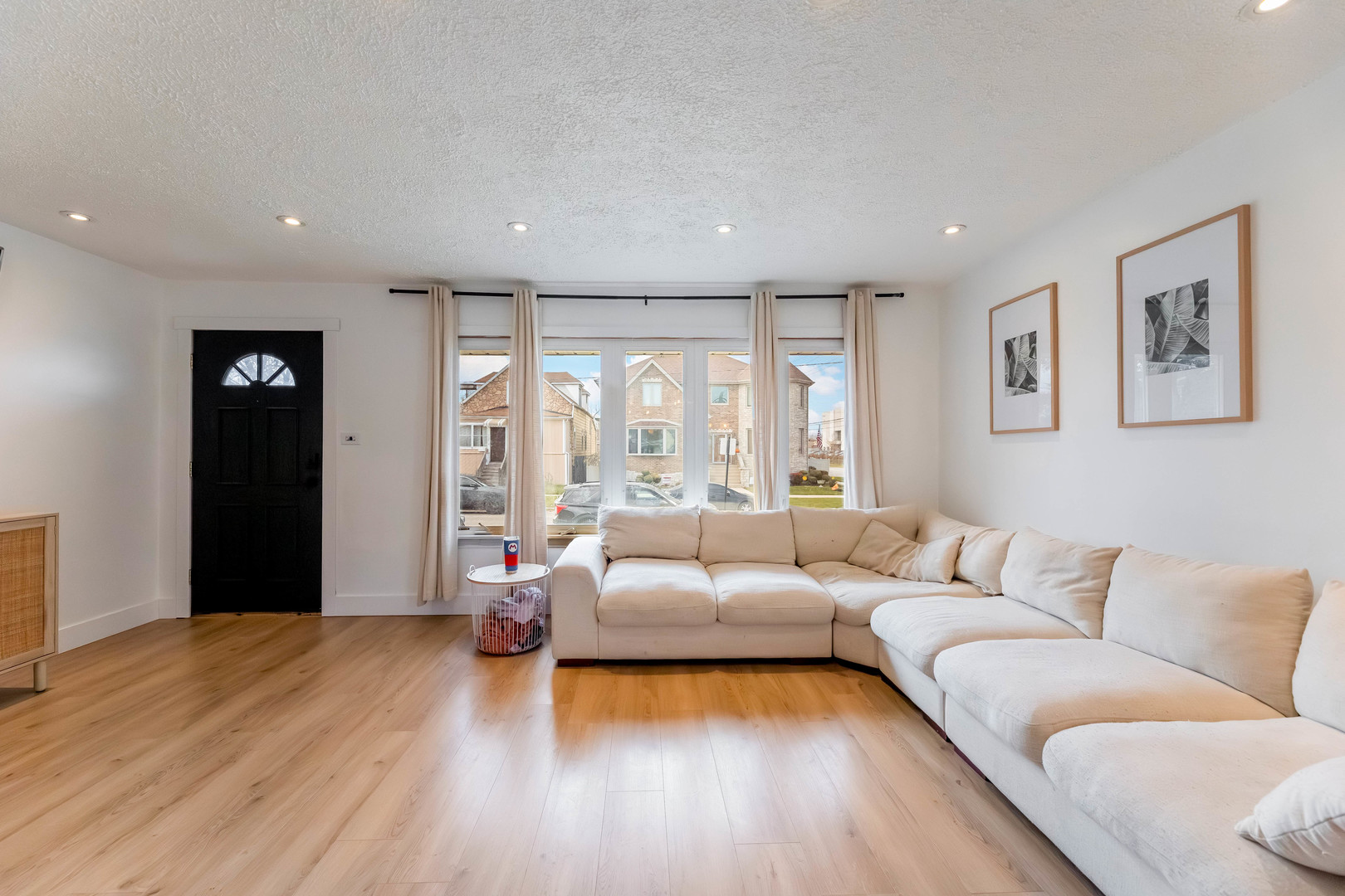 5105 South Mobile Avenue Chicago, IL 60638 - Photo 4 of 21 a living room with furniture and a large window