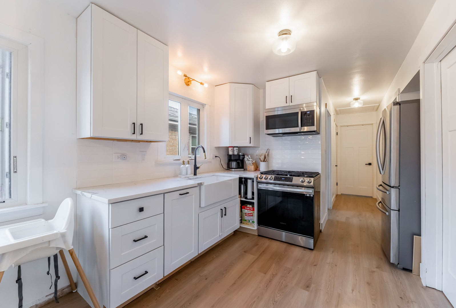 5105 South Mobile Avenue Chicago, IL 60638 - Photo 7 of 21 a kitchen with stainless steel appliances granite countertop a stove a sink and a refrigerator