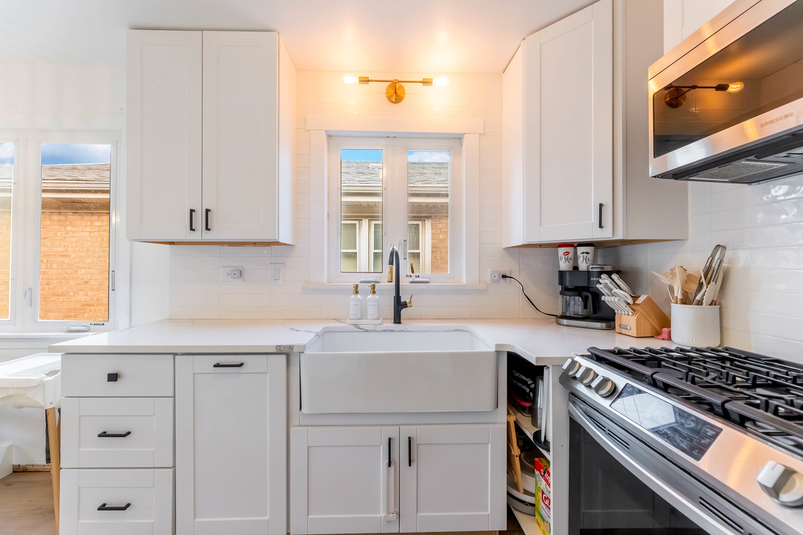 5105 South Mobile Avenue Chicago, IL 60638 - Photo 9 of 21 a kitchen with cabinets appliances and a window