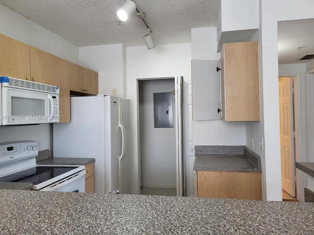 8070 North Nob Hill Road, Unit 208 Tamarac, FL 33321 - Photo 4 of 16 a bathroom with a sink and a mirror