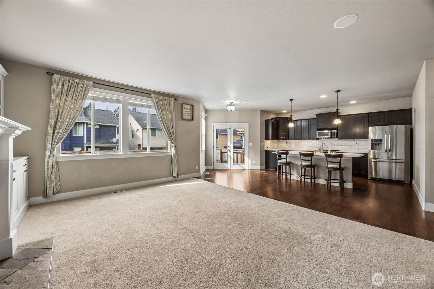20522 95th Ave Court East Graham, WA 98338 - Photo 11 of 29 a living room with furniture and a kitchen view