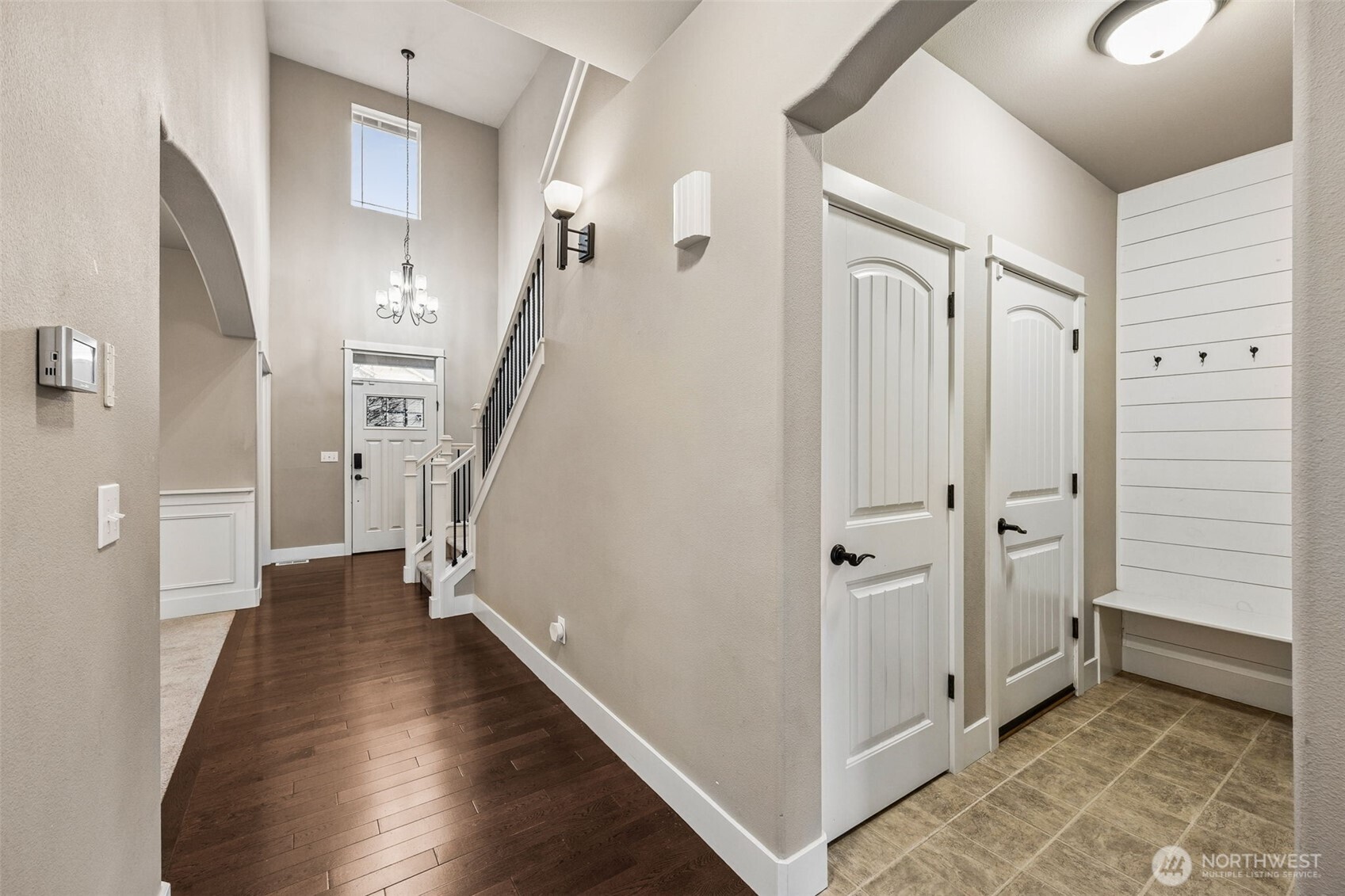 20522 95th Ave Court East Graham, WA 98338 - Photo 15 of 29 a view of a hallway with wooden floor and staircase