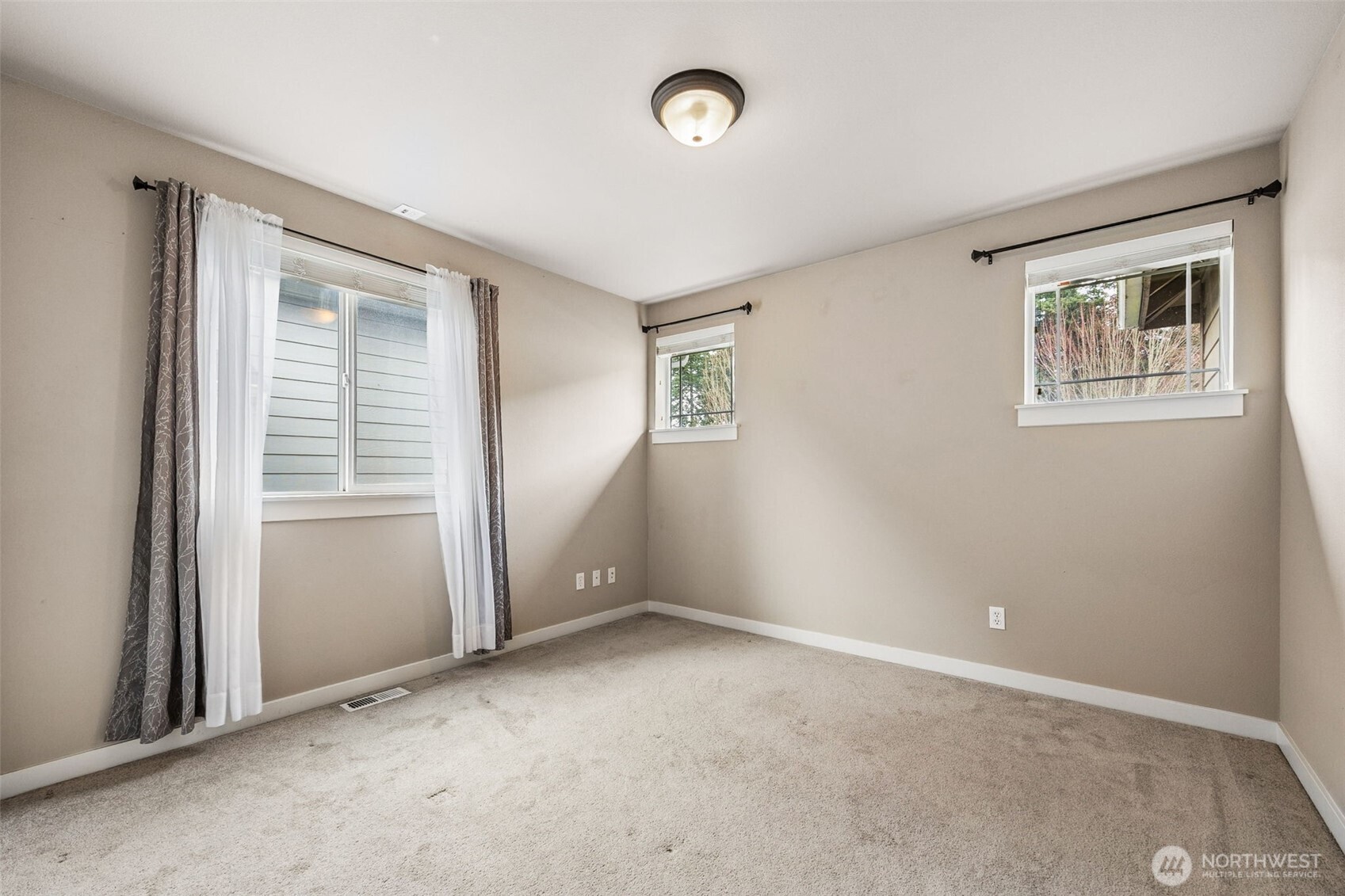 20522 95th Ave Court East Graham, WA 98338 - Photo 17 of 29 an empty room with windows