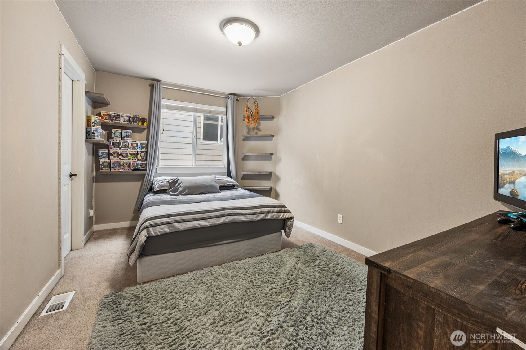 20522 95th Ave Court East Graham, WA 98338 - Photo 19 of 29 a bedroom with a bed and a window
