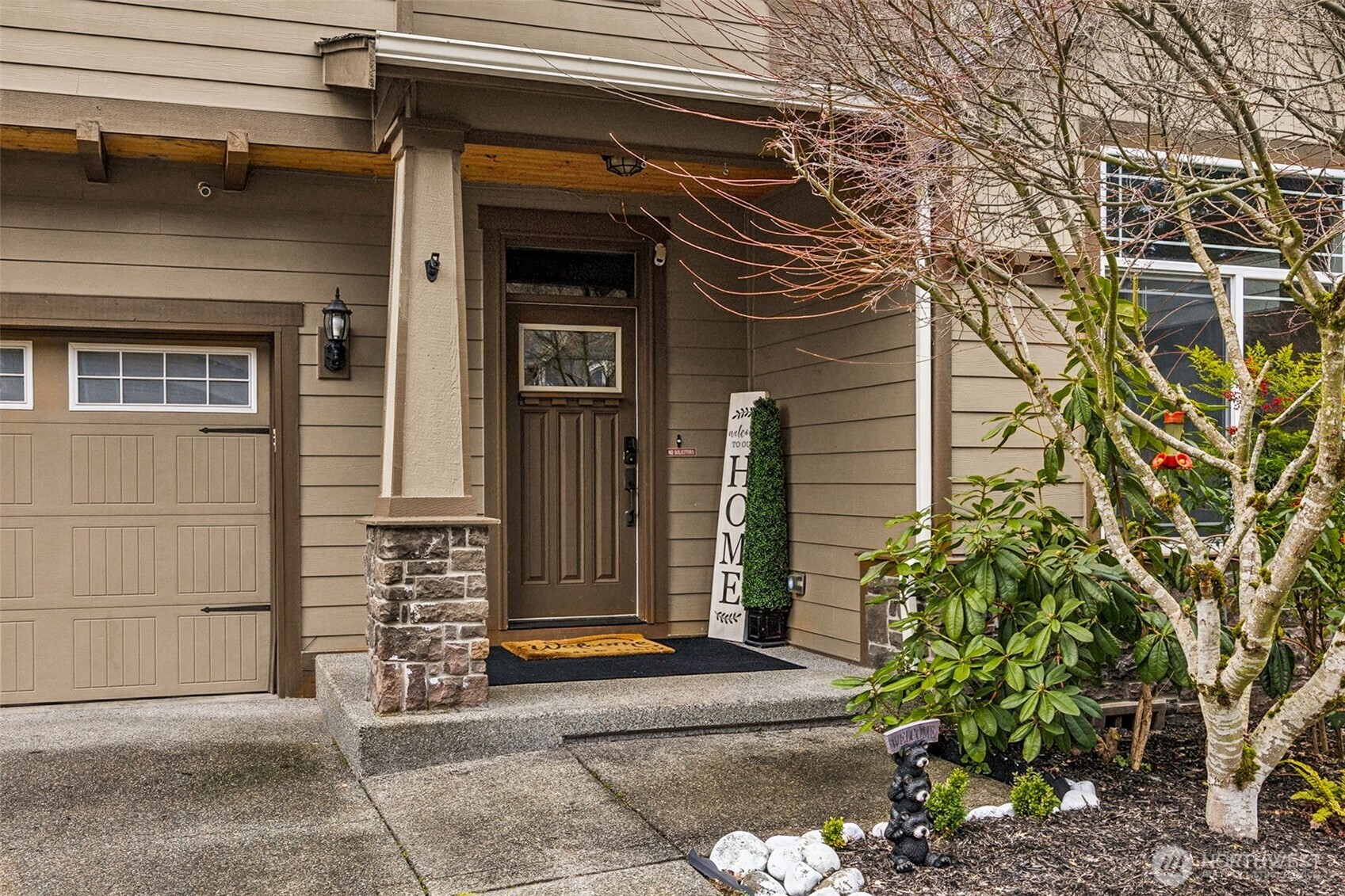 20522 95th Ave Court East Graham, WA 98338 - Photo 2 of 29 a front view of a house with a garden