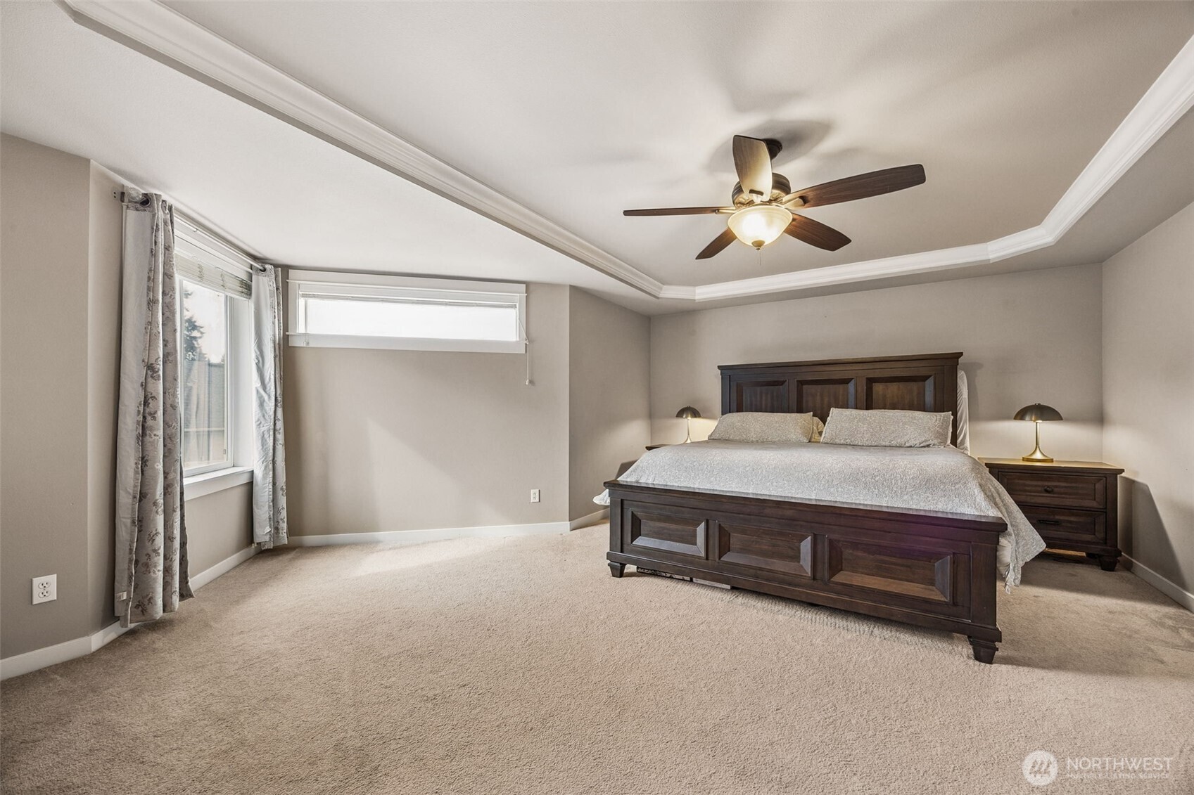 20522 95th Ave Court East Graham, WA 98338 - Photo 21 of 29 a bedroom with a bed and a ceiling fan