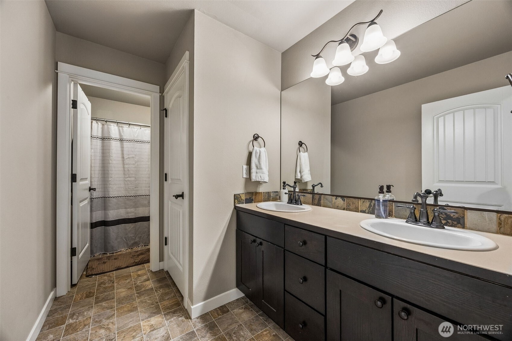 20522 95th Ave Court East Graham, WA 98338 - Photo 22 of 29 a bathroom with a double vanity sink and a mirror
