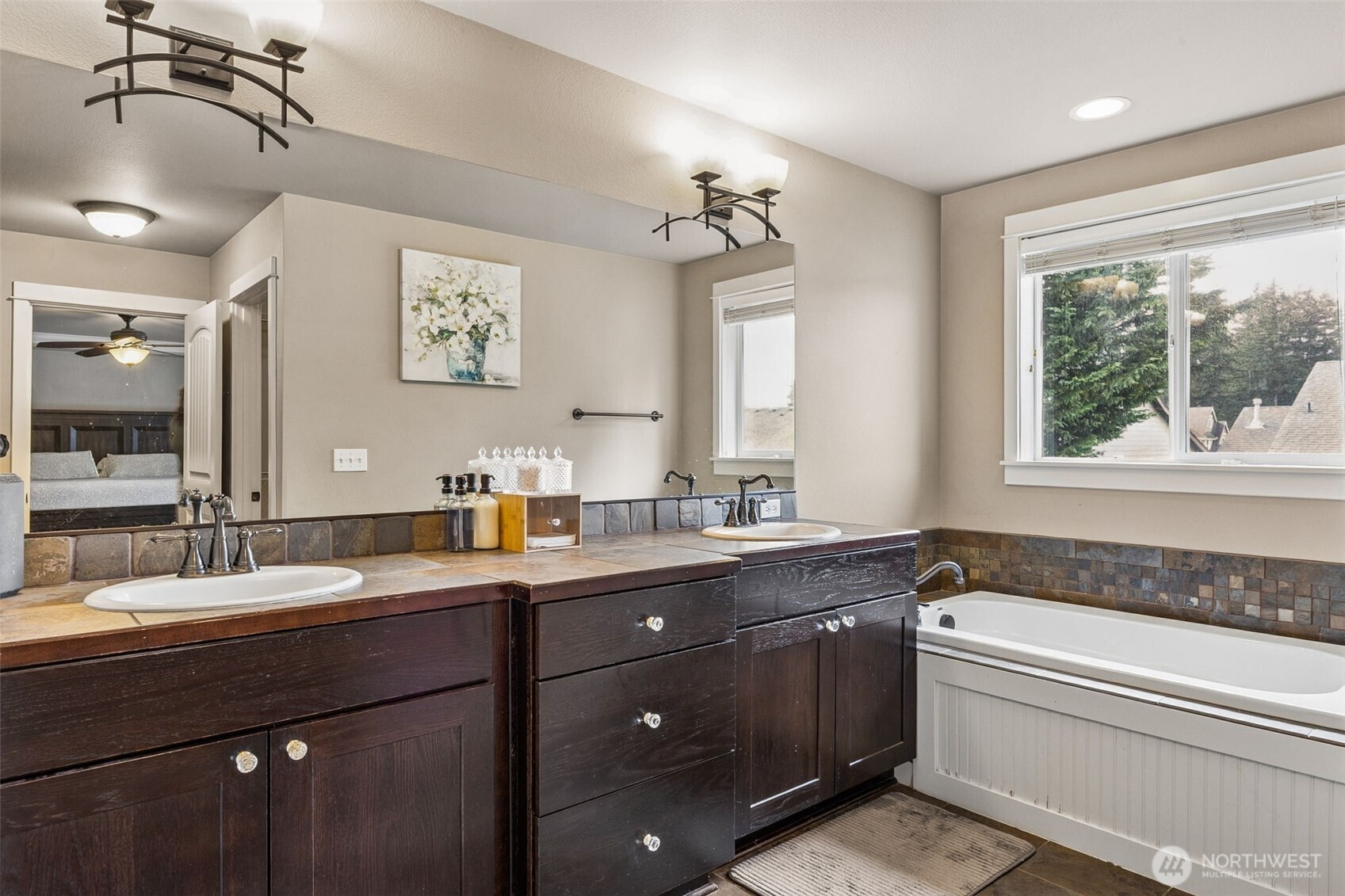 20522 95th Ave Court East Graham, WA 98338 - Photo 23 of 29 a bathroom with a granite countertop sink mirror and double