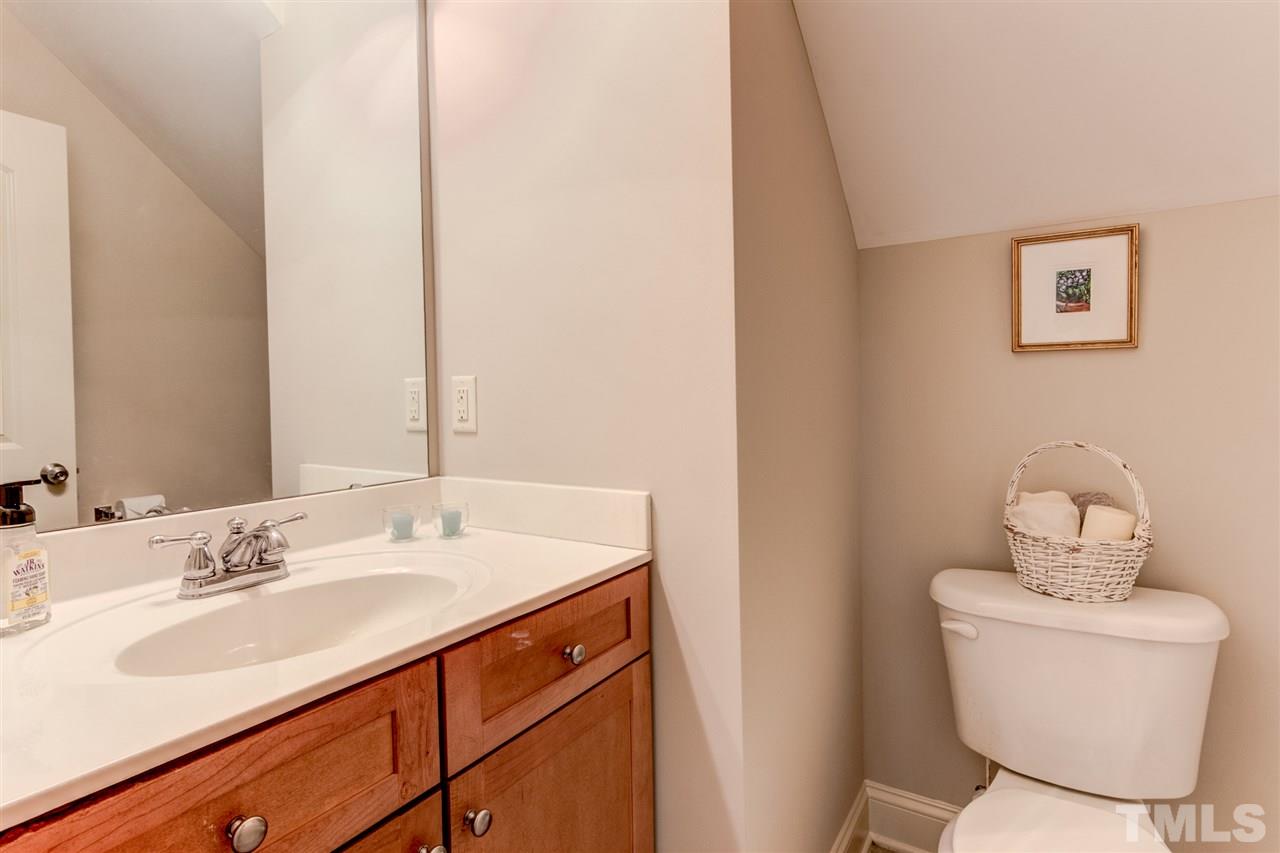 4143 White Kestrel Drive Raleigh, NC 27616 - Photo 11 of 30 a bathroom with a sink and a toilet