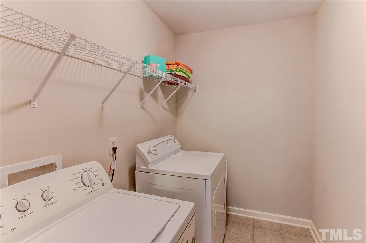 4143 White Kestrel Drive Raleigh, NC 27616 - Photo 14 of 30 a utility room with dryer and washer