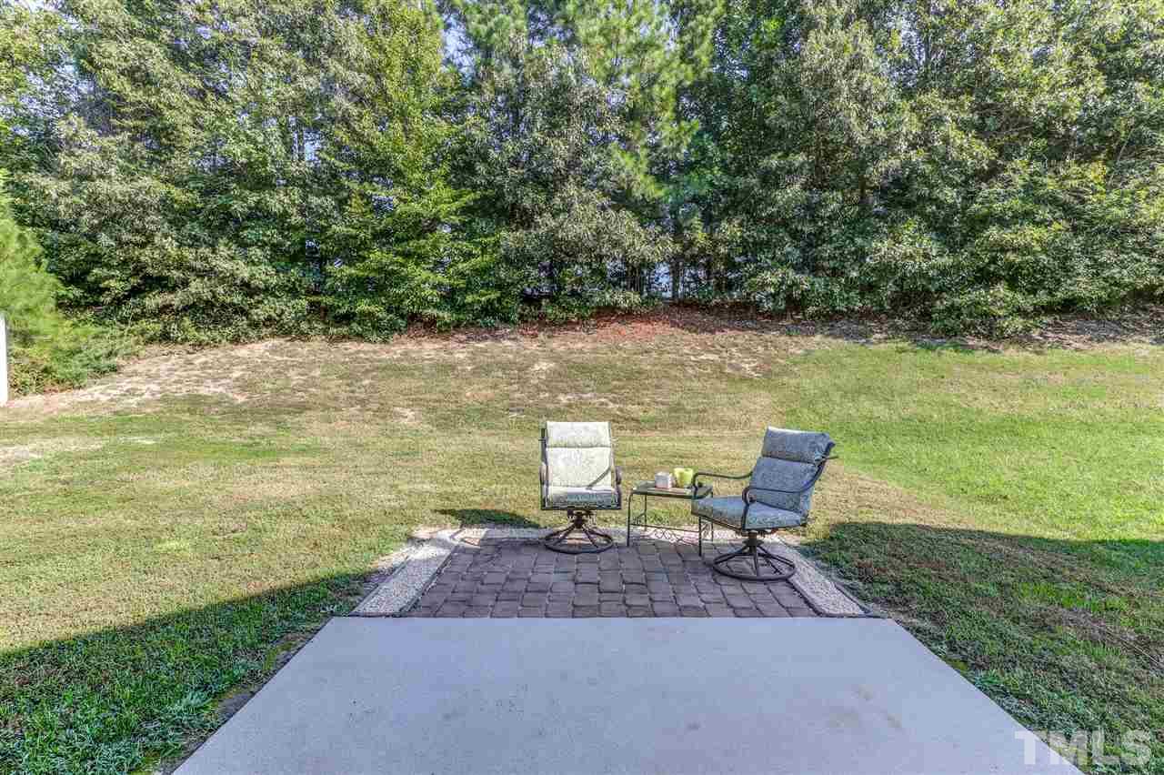 4143 White Kestrel Drive Raleigh, NC 27616 - Photo 25 of 30 a view of a lake with a yard