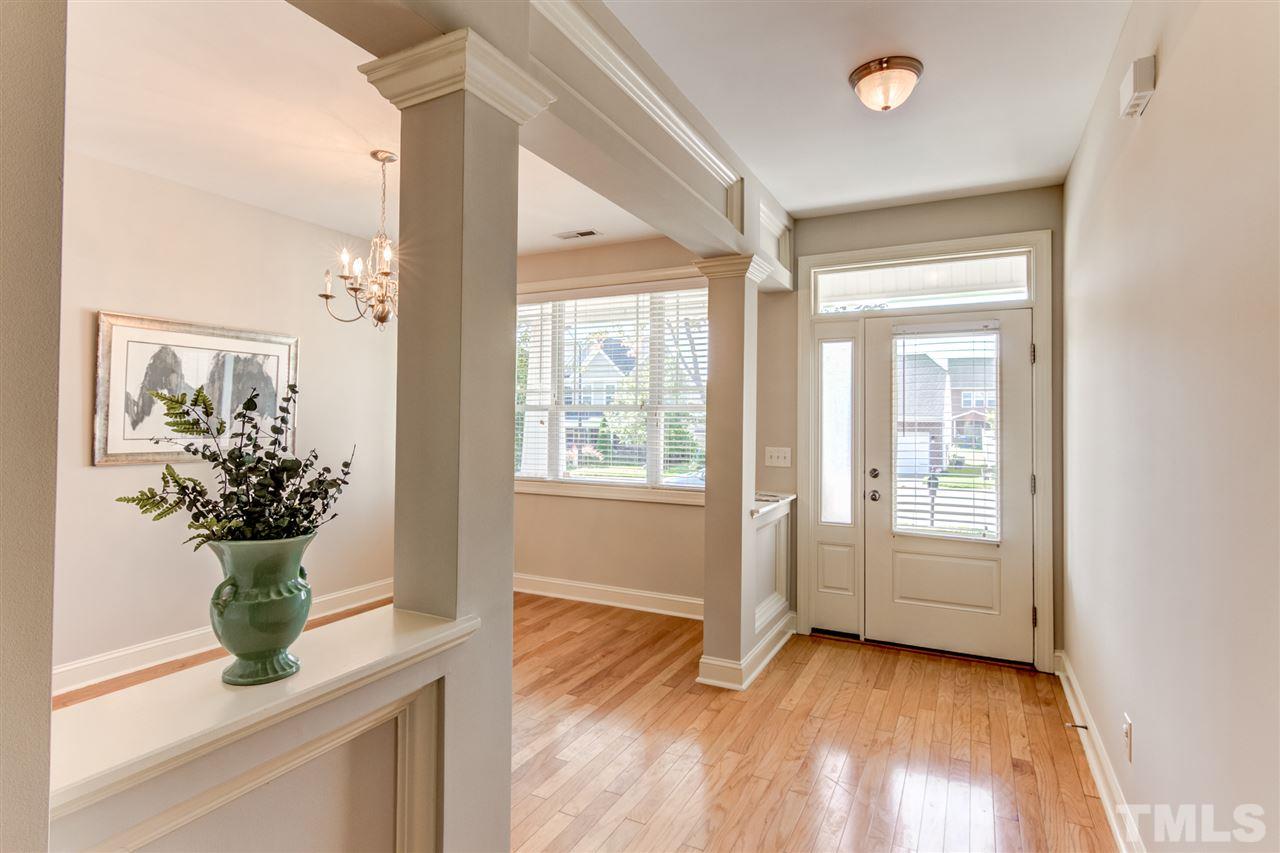 4143 White Kestrel Drive Raleigh, NC 27616 - Photo 4 of 30 a view of an entryway with wooden floor and a potted plant