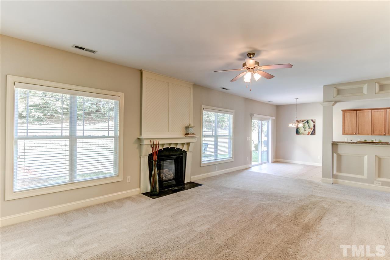 4143 White Kestrel Drive Raleigh, NC 27616 - Photo 9 of 30 a view of livingroom with furniture fireplace and a window