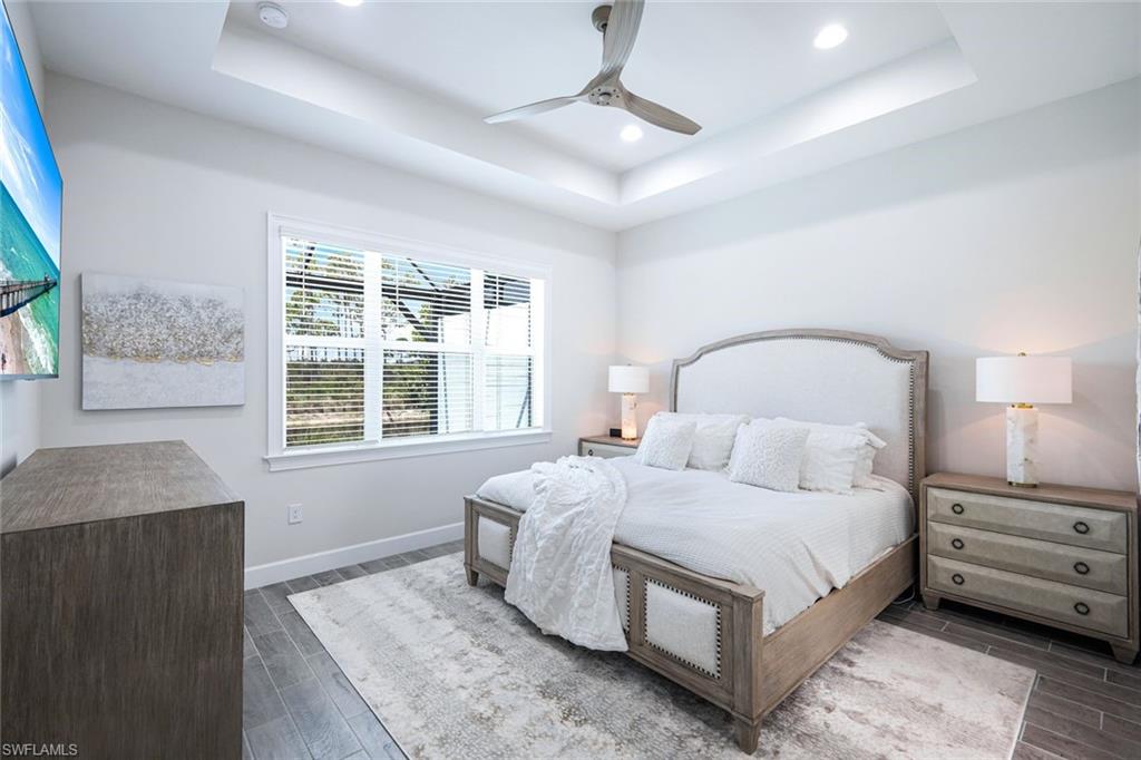 6875 Saona Court Naples, FL 34113 - Photo 11 of 21 a bedroom with a bed and a window