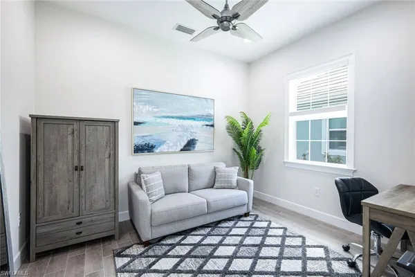 a living room with furniture and a window